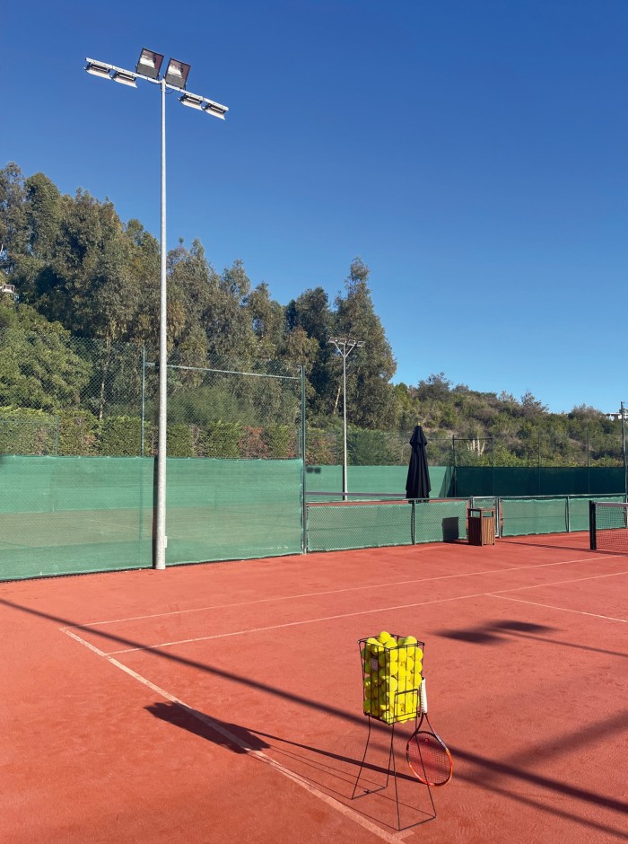 One of the two tennis courts at Finca Cortesin