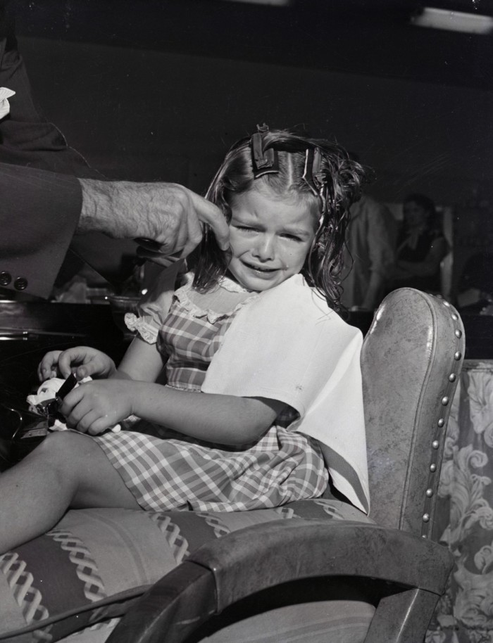 A girl in the hairdresser’s chair in 1949
