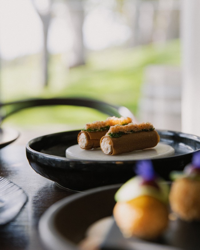Canapés on Polperro’s set menu include shrimp, caviar and salmon mousse in a crispy roll
