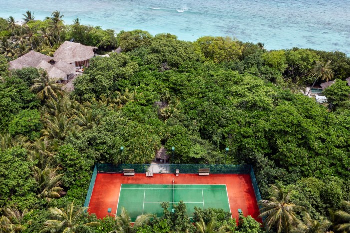 A court with jungle surrounds at Soneva Fushi