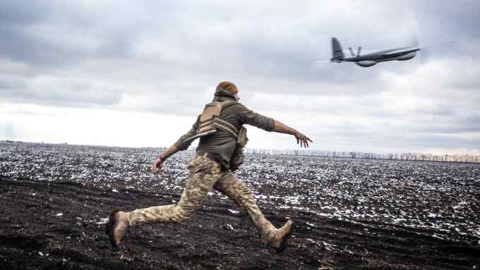 A Ukrainian serviceman operates a reconnaissance drone