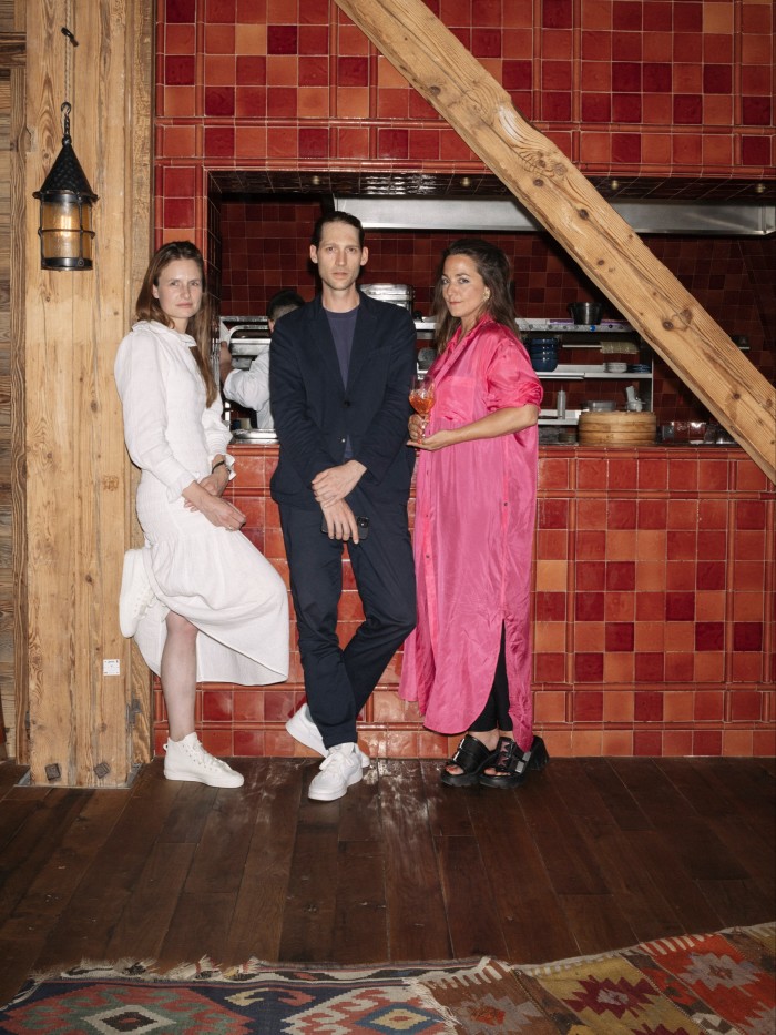 Zürich Art Weekend organiser Charlotte von Stotzingen (left), and gallerists Gregor Staiger and?Marie Lusa, in the La Mu?a restaurant upstairs at La Réserve Eden au Lac