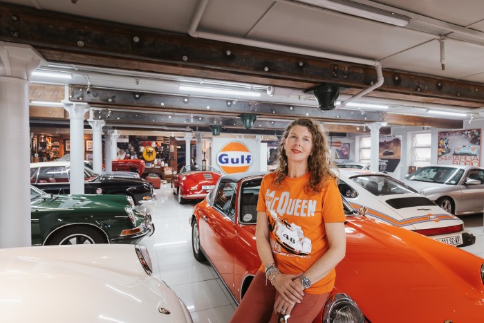 Michelle Hambly-Grobler in her garage with her restored Porsche Targa and (to the left) her green 1970 Porsche 911 2.2 S
